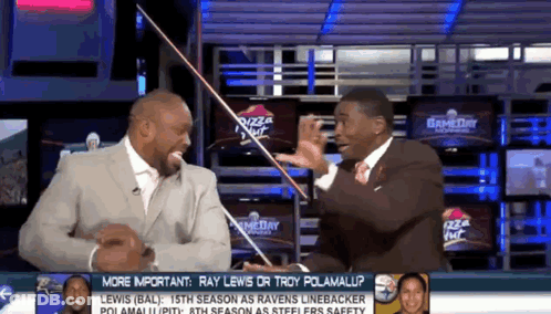 Two Men On TV Show Talking Ray Lewis Or Troy Polamalup GIF