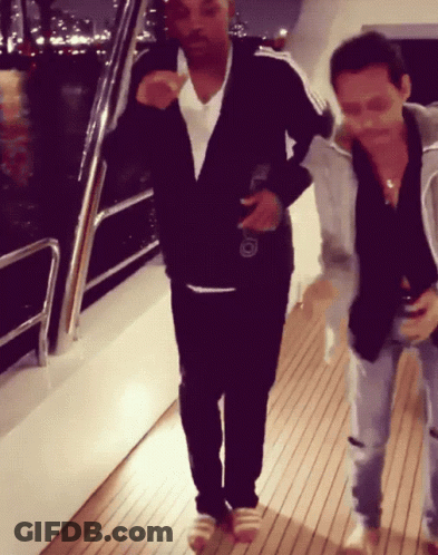 Two Men On Wooden Deck One Holding Beer GIF