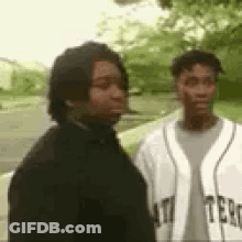 Two Men, One In Baseball Jersey GIF
