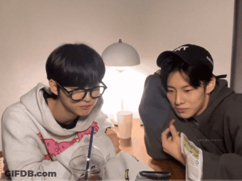 Two Men, One In Black TNT Hat GIF