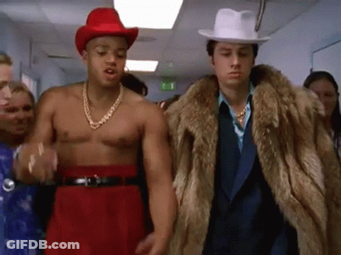 Two Men, One In Fur Coat And Hat GIF