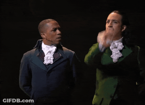 Two Men One In Green Suit GIF