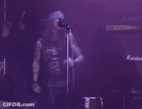 Two Men, One In Guns N' Roses Shirt GIF
