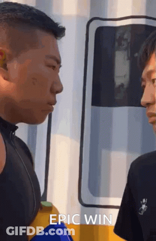 Two Men One Wearing Epic Win Shirt GIF