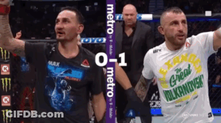 Two Men One Wearing Great Vulcandish Shirt GIF