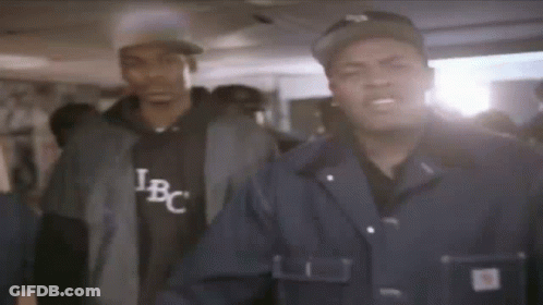 Two Men One Wearing IBC Shirt GIF