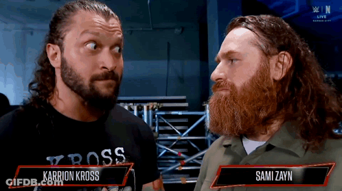 Two Men One Wearing Karrion Kross Shirt GIF