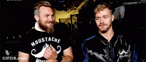 Two Men One Wearing Moustache Shirt GIF