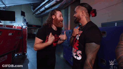 Two Men One Wearing Smack Down Shirt GIF