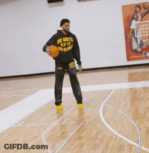 Two Men Playing Basketball In Front Of A Poster That Says " Lakers " On It GIF