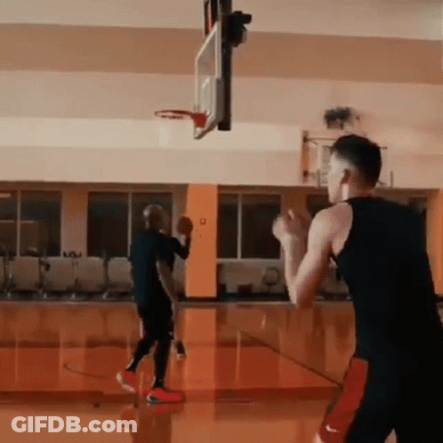 Two Men Playing Basketball One In Nike Shorts GIF