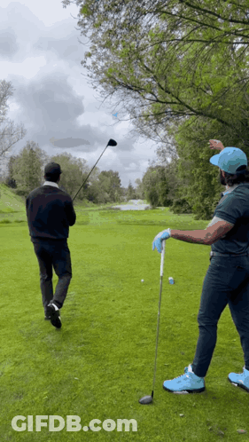 Two Men Playing Golf GIF