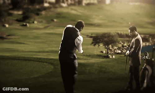 Two Men Playing Golf On A Lush Green Course GIF