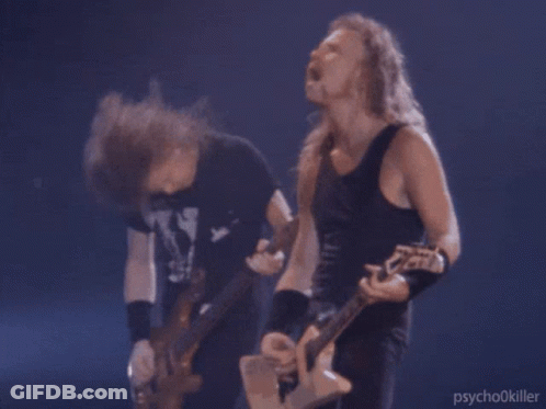 Two Men Playing Guitars, One In Psychokiller Tank Top GIF
