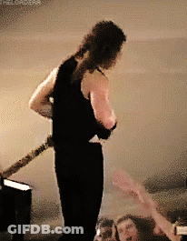 Two Men Playing Guitars, One In Psychokiller Tank Top GIF