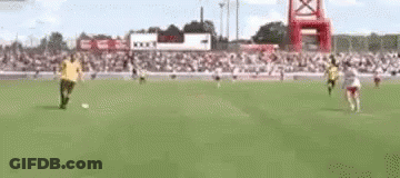 Two Men Playing Soccer GIF