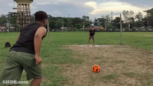 Two Men Playing Soccer One In Black Shirt GIF