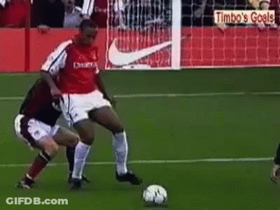 Two Men Playing Soccer With Timbo's Goals Sign GIF