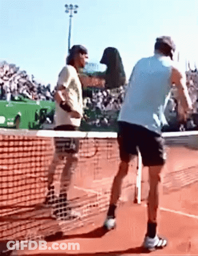 Two Men Playing Tennis With Crowd Watching GIF