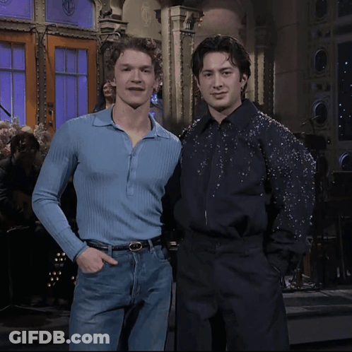 Two Men Posing Blue Shirt And Black Shirt GIF