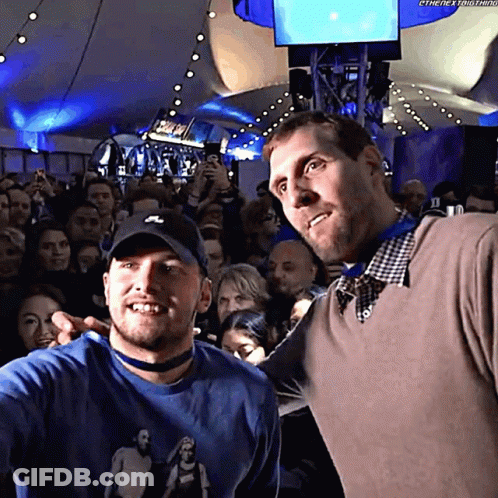 Two Men Posing In Crowd, One With Nike Hat GIF