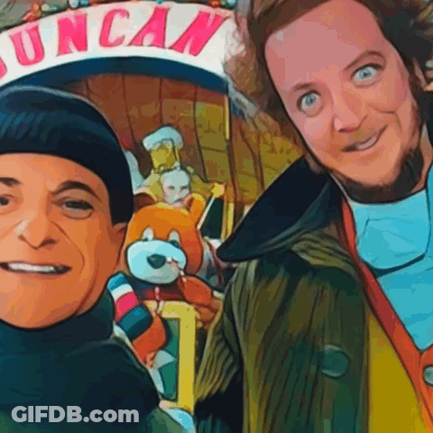 Two Men Posing In Front Of Duncan Sign GIF