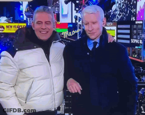 Two Men Posing In Front Of Sephora Sign GIF