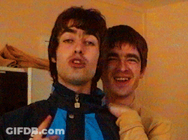 Two Men Posing One In Adidas Jacket GIF