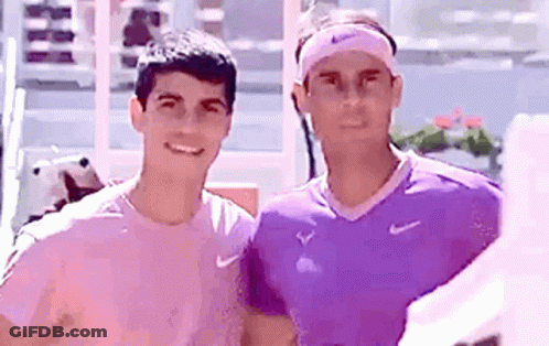 Two Men Posing One Wearing Headband GIF