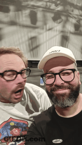 Two Men Posing One Wearing Krav Hat GIF