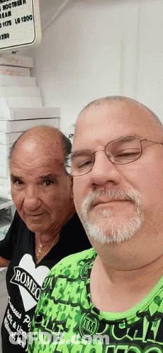 Two Men Posing One Wearing Romeo Shirt GIF