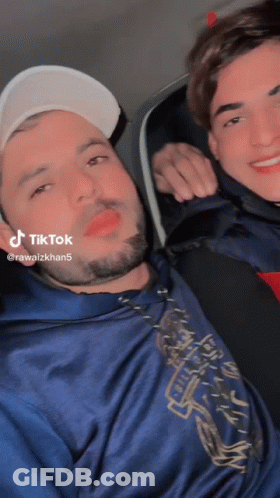 Two Men Posing One With TikTok Sticker GIF