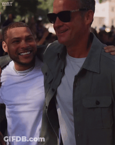 Two Men Posing With WBT Sports GIF