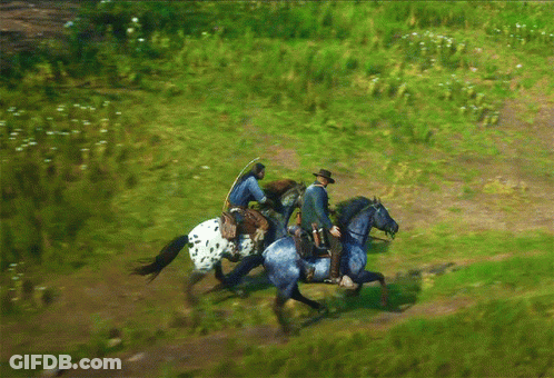 Two Men Riding Horses On Dirt Path GIF