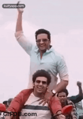 Two Men Riding Motorcycle One Carrying Other GIF