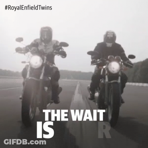 Two Men Riding Motorcycles Saying The Wait Is R GIF