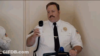 Two Men Riding Segways In Front Of An Exit Sign GIF