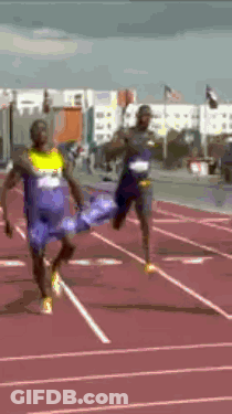 Two Men Running On Track One In Blue Shirt Saying A GIF