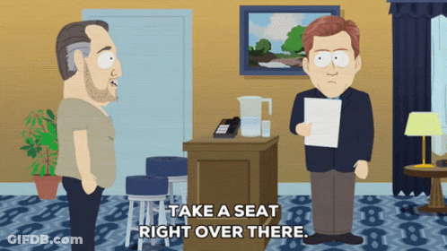 Two Men Say Take Seat Right Over There GIF