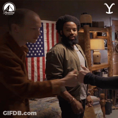 Two Men Shake Hands American Flag Paramount Logo GIF