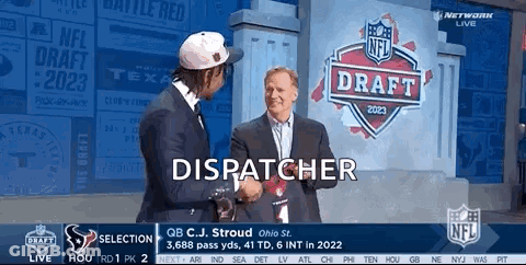 Two Men Shake Hands In Front Of A Sign That Says Dispatcher GIF