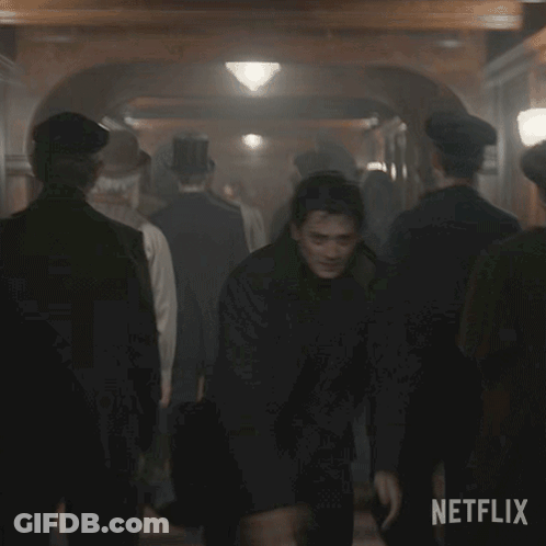 Two Men Shaking Hands In Crowd Netflix GIF