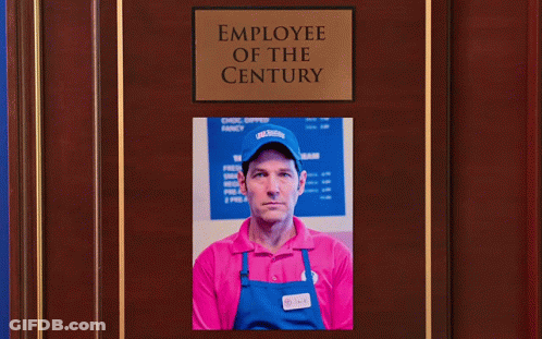 Two Men Shaking Hands In Front Of Employee Of The Century Plaque GIF
