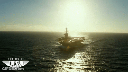 Two Men Shaking Hands In Front Of Planes GIF