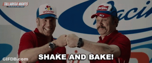Two Men Shaking Hands In Front Of Talladega Nights Sign GIF