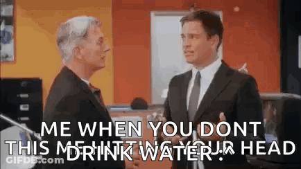 Two Men Shaking Hands In Office GIF