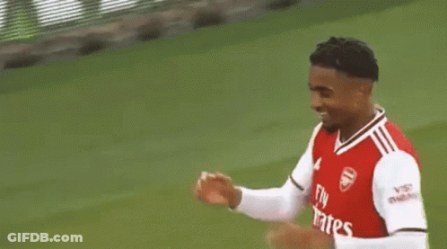 Two Men Shaking Hands On Soccer Field GIF