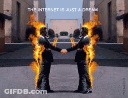 Two Men Shaking Hands With Flames Coming Out Of Their Bodies And The Words The Internet Is Just A Dream GIF