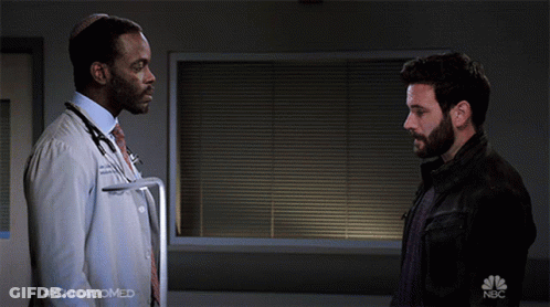 Two Men Shaking Hands With NBC Logo GIF