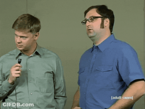 Two Men Singing In Front Of A Microphone With The Words Fair Enough Above Them GIF
